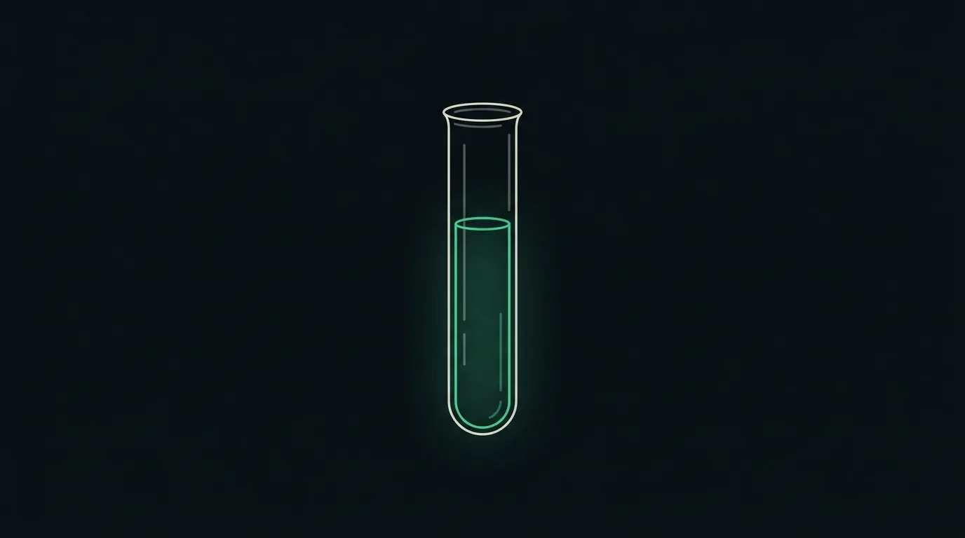 A tube of blood separated into a packed emerald red-cell column below clear plasma above.